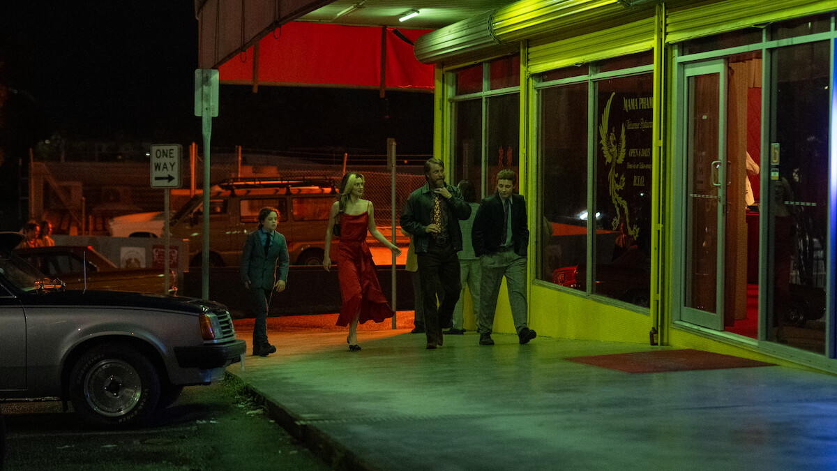 Felix Cameron as Eli Bell, Phoebe Tonkin as Frances Bell, Travis Fimmel as Lyle Orlik, and Lee Halley as Gus Bell in a still image from the series ‘Boy Swallows Universe’