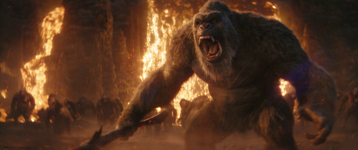 Kong stands in front of a blazing fire while screaming in ‘Godzilla x Kong: The New Empire’