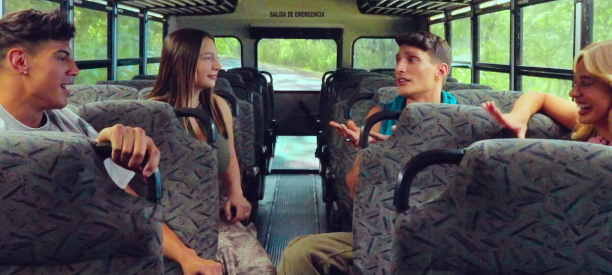 Tony Castellanos, Lexi Goldberg, Lorenzo Nobilio, and Georgia Hassarati chatting in the bus.