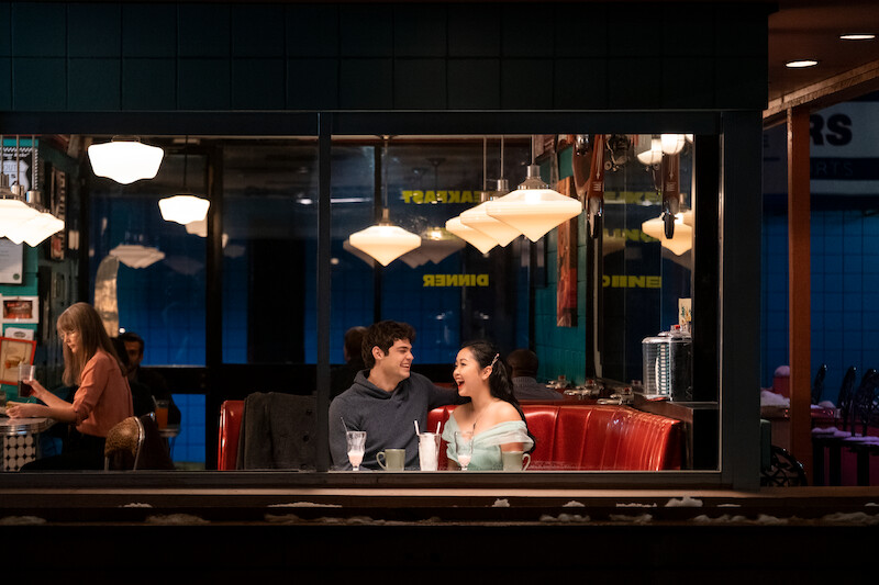 Noah Centineo as Peter and Lana Condor as Lara Jean sitting at a diner.