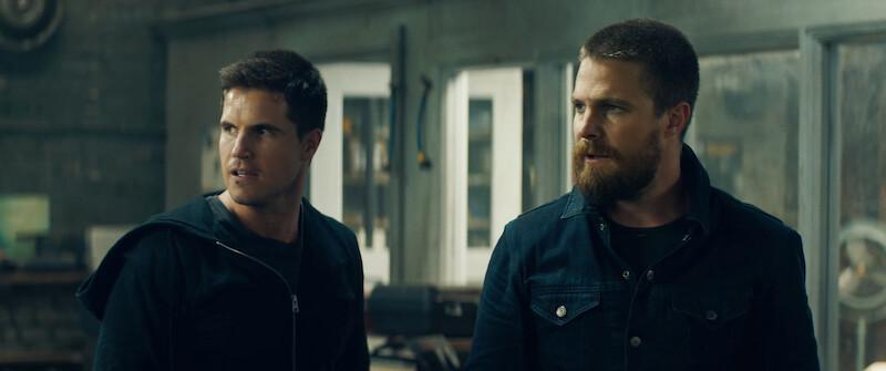 Robbie Amell as Connor Reed and Stephen Amell as Garrett in 'Code 8'