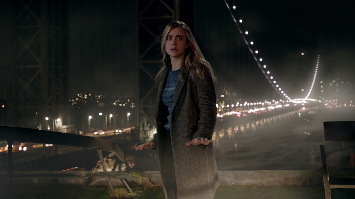 A woman near a bridge.