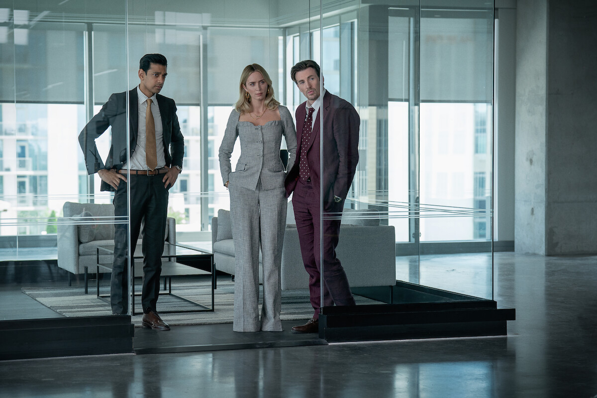 Amit Shah as Paley, Emily Blunt as Liza, and Chris Evans as Brenner.