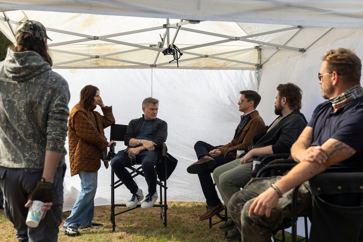 Tony Demil as Raf, director Liz Friedlander, executive producer/showrunner Kevin Williamson, Topher Grace as Grady, Austin Alexander as Stevie, Josh Crotty as Nate on the set of ‘The Waterfront.’
