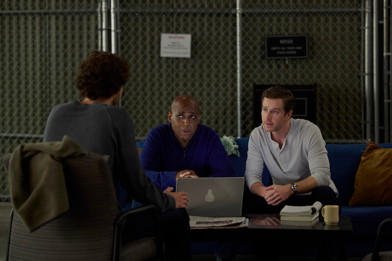 three people sitting down 