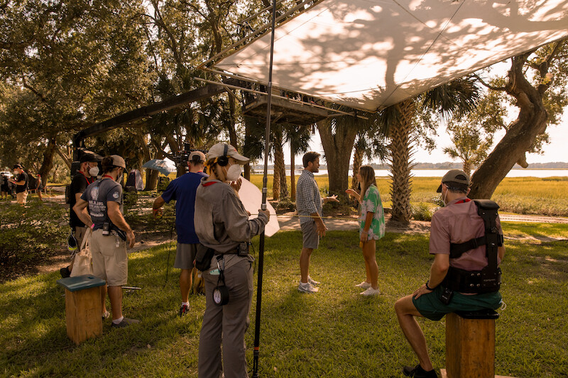 Charles Esten as Wade Cameron and Madelyn Cline as Sarah Cameron in Outer Banks Season 2 Behind-the-Scenes Photo Gallery
