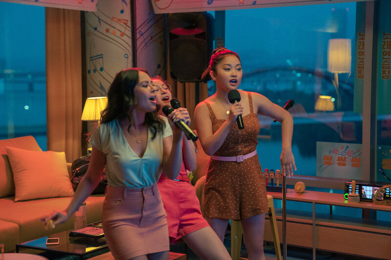 Anna Cathcart as Kitty, Lana Condor as Lara Jean, and Janel Parrish as Margot singing karaoke.