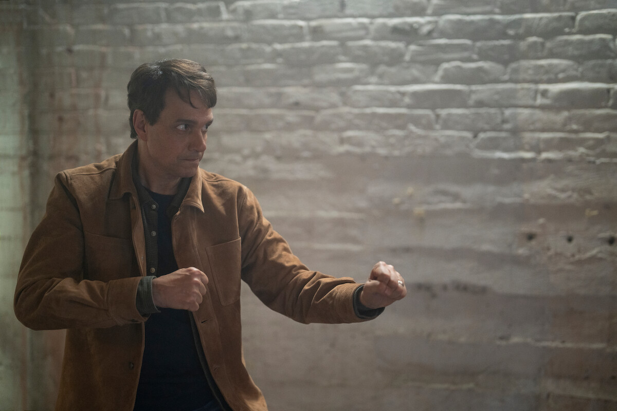 Ralph Macchio as Daniel LaRusso stands in a fighting position in Season 6 of ‘Cobra Kai.’