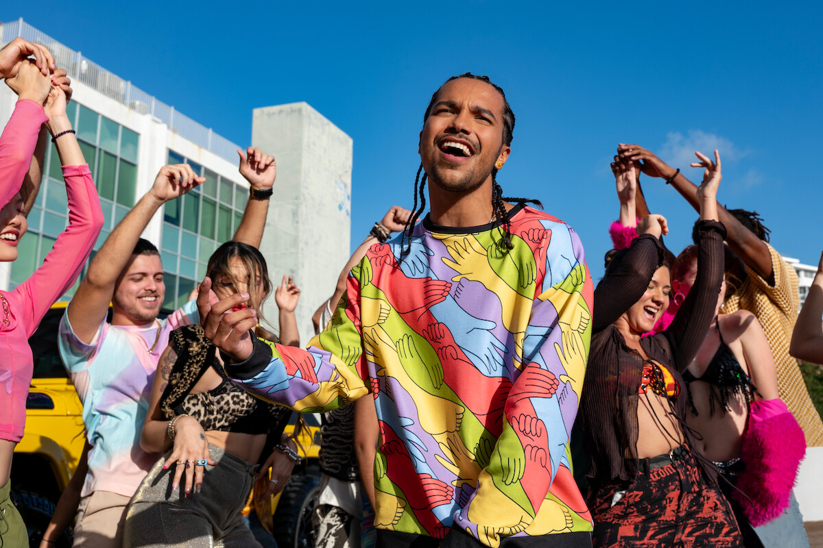 Tyler Dean Flores as Santi sings in front of a crowd in Season 1 of ‘Neon.’