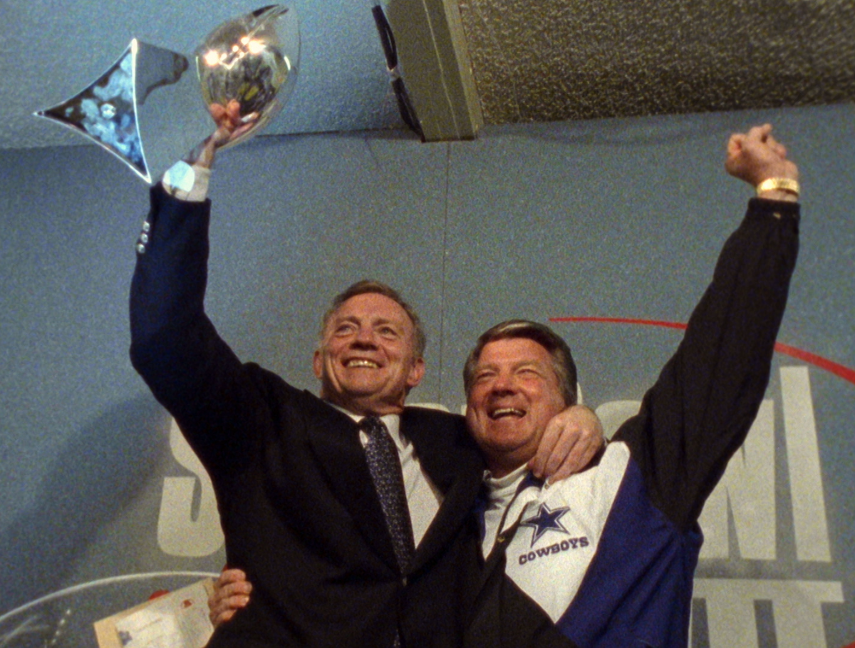 Jerry Jones and Jimmy Johnson holding The Vince Lombardi Trophy