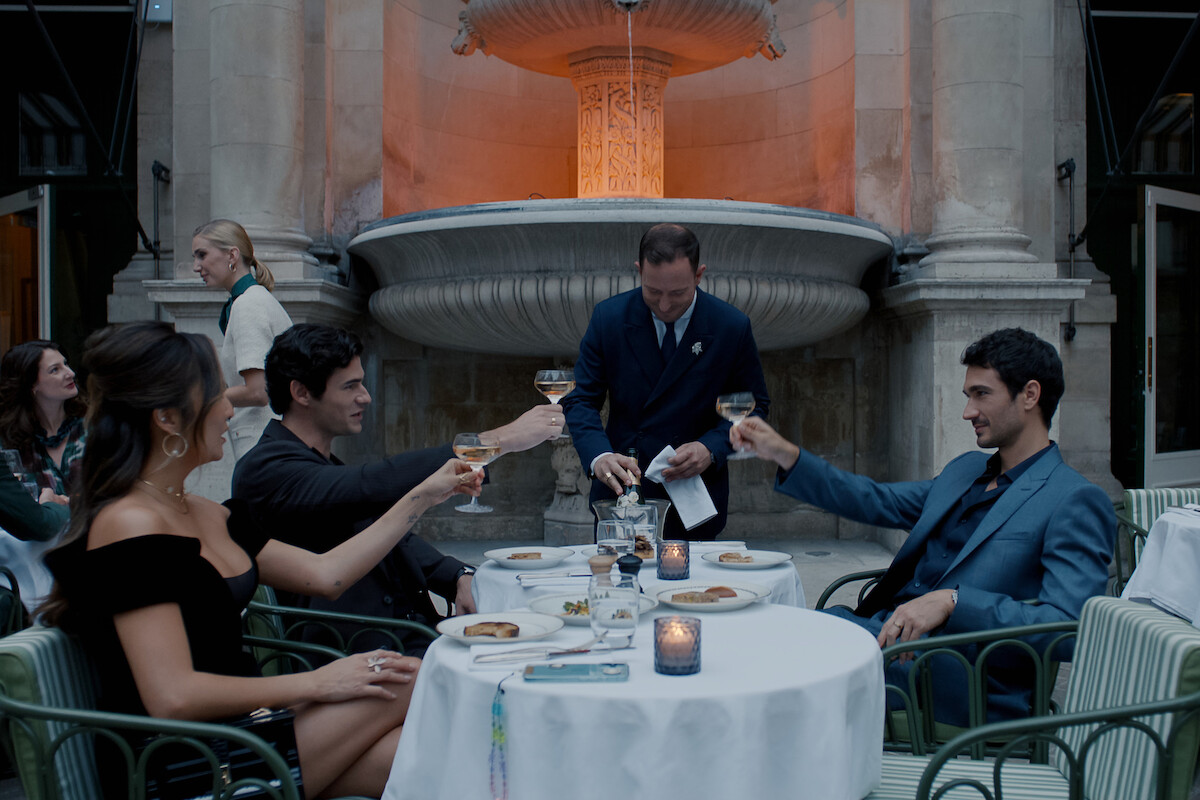 Ashley Park as Mindy, Paul Forman as Nicolas De Leon and Eugenio Franceschini as Marcello in ‘Emily in Paris’ Season 5.