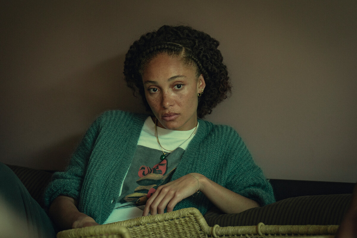 Adwoa Aboah as Becks lounges on a couch in Season 3 of ‘Top Boy.’