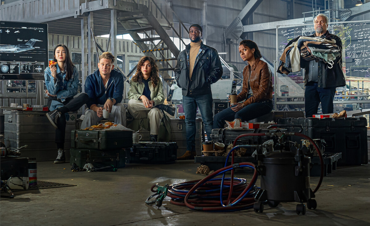 Yun Jee Kim as Mi-Su, Billy Magnussen as Magnus, Úrsula Corberó as Camila, Kevin Hart as Cyrus, Gugu Mbatha-Raw as Abby, and Vincent D’Onofrio as Denton in ‘Lift’.