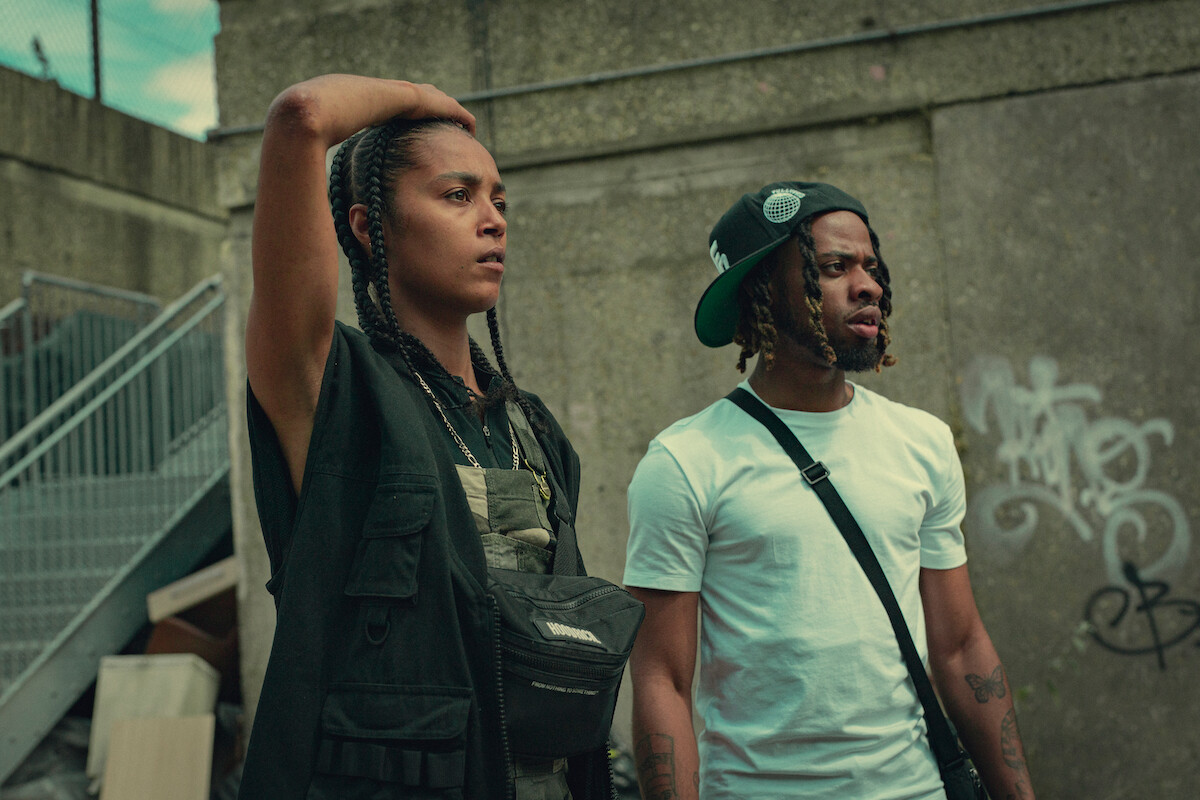 Jasmine Jobson as Jaq and Nyshai Caynes as Romy stand together looking concerned in Season 3 of ‘Top Boy.’