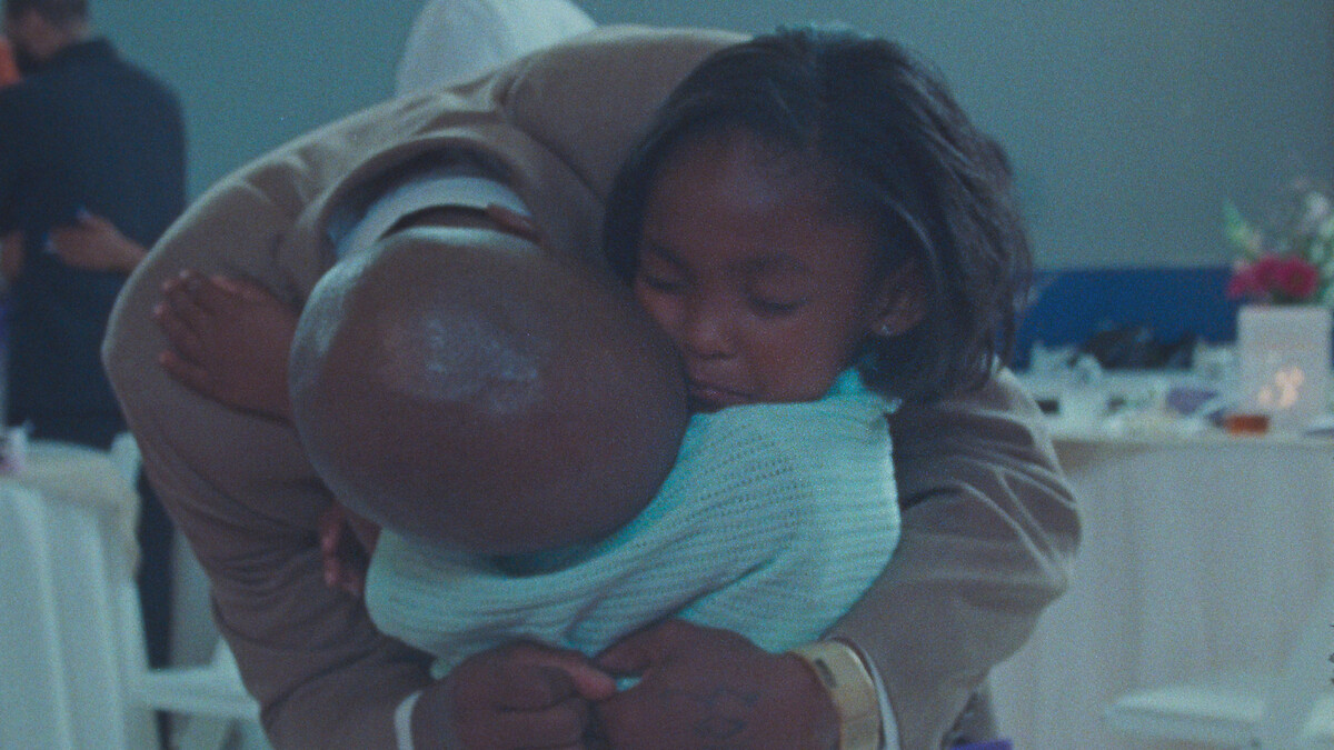 Keith Sweptson hugs Aubrey Smith in a heartbreaking picture.