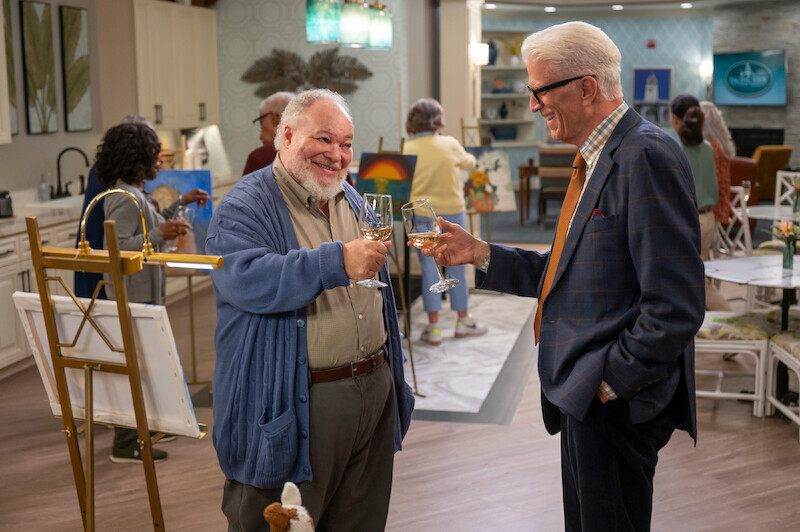 Stephen McKinley Henderson as Calbert and Ted Danson as Charles clink wine glasses in Season 1 of 'A Man on the Inside'