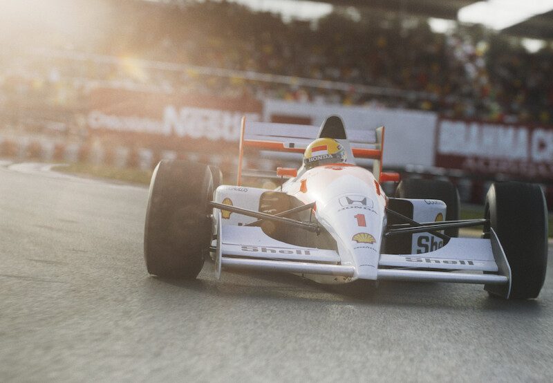 A race car drives on a track.
