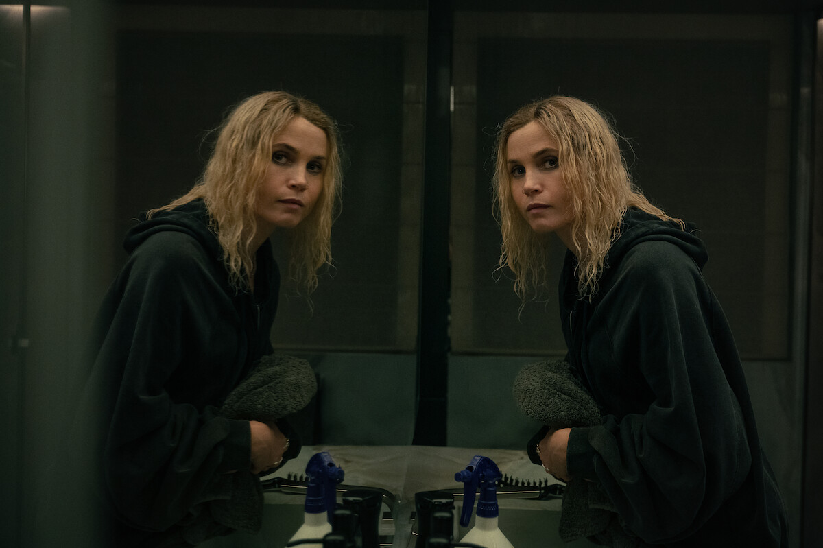Gitte Witt faces her reflection in the mirror with wavy wet hair.