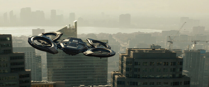 A futuristic aircraft hovers over a city in 'Code 8'