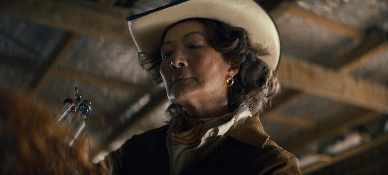 Rosalind Chao as Zhang wears a cowboy hat in Season 3 of 'Sweet Tooth'