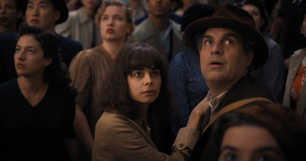 Aria Mia Loberti and Mark Ruffalo standing in a crowd of people. 