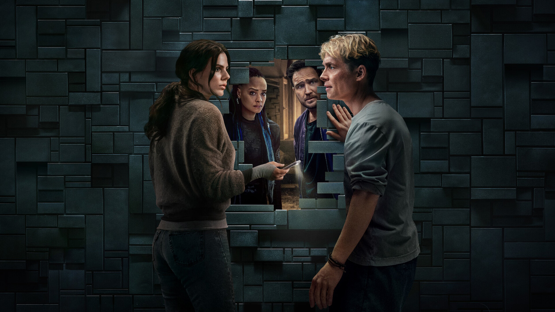 Brick - two couples on either side of a brick wall. 