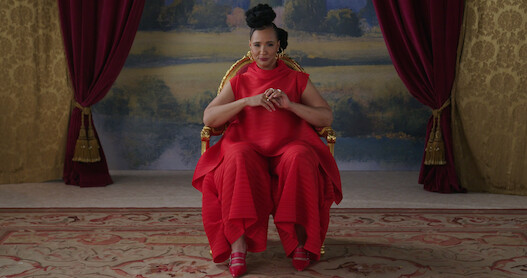 Golda Rosheuvel sitting in a chair