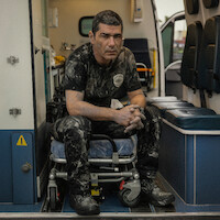 Man in sullied police uniform.