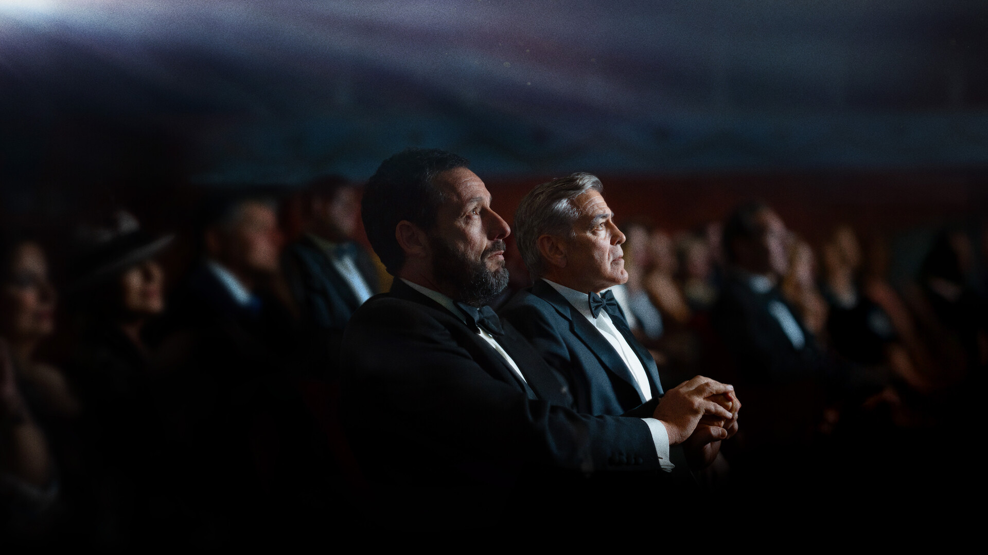 Jay Kelly - Jay Kelly (George Clooney) and Ron (Adam Sandler) in a movie theater. 
