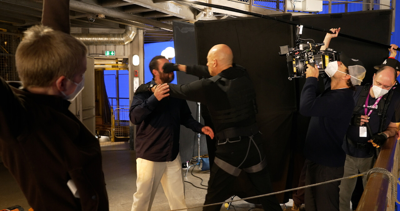 Mark Strong and Adam Sandler filming a stunt for Murder Mystery 2.