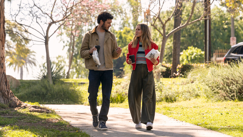 Adam Brody as Noah and Kristen Bell as Joanne walk in a park together in Season 1 of 'Nobody Wants This'