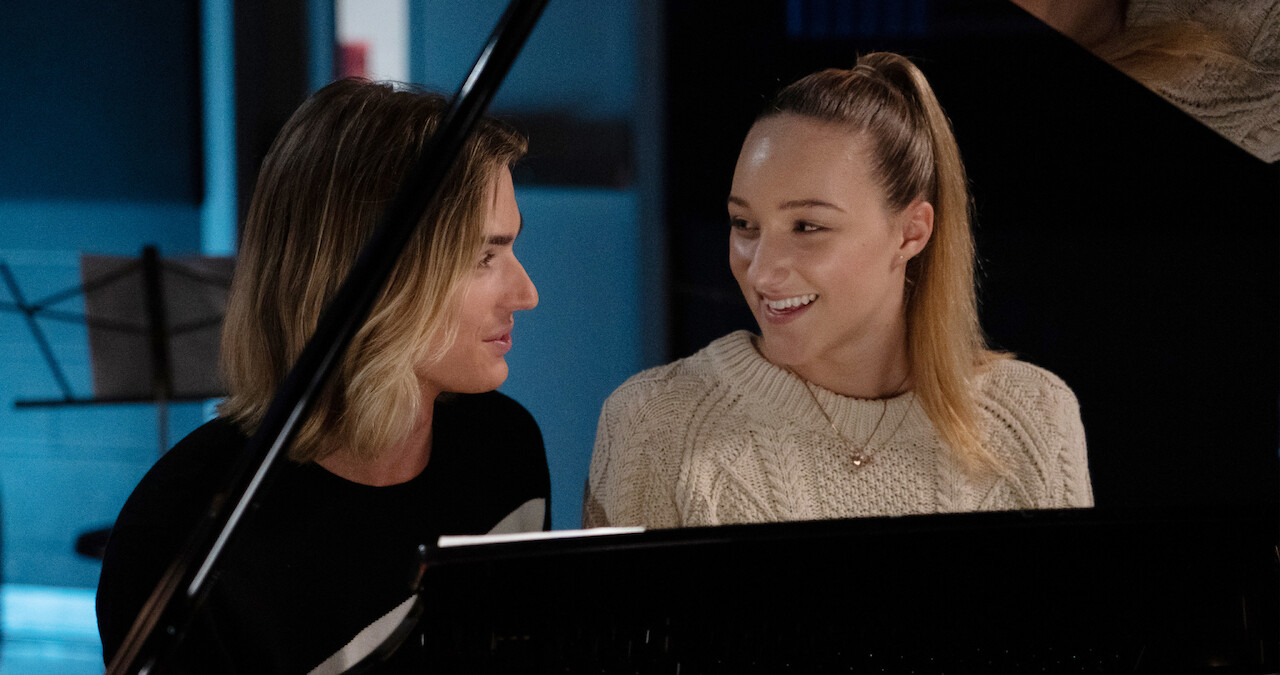Jodi and Stig sitting at a piano