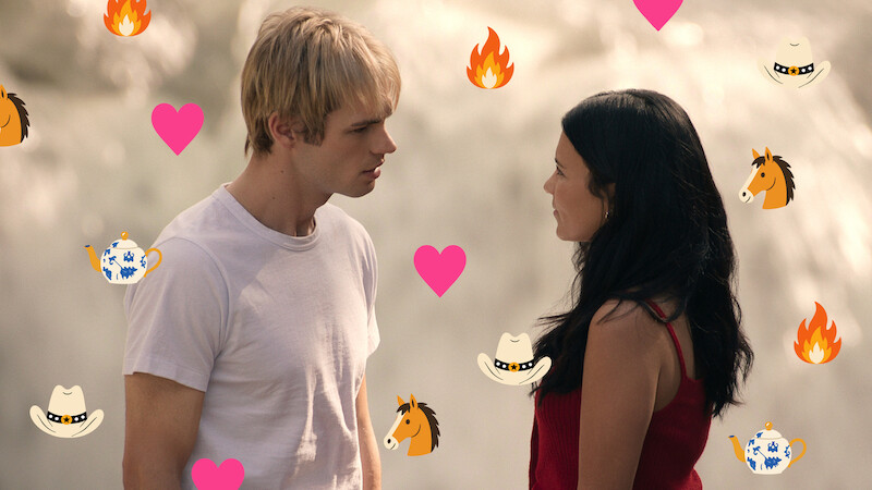 A young man and woman stand facing each other outdoors, possibly near a waterfall. Colorful icons of hearts, flames, horses, cowboy hats, and teapots are overlaid on the image, adding a playful, romantic tone.
