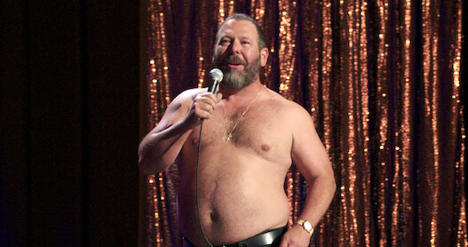 Comedian Bert Kreischer onstage with his shirt off