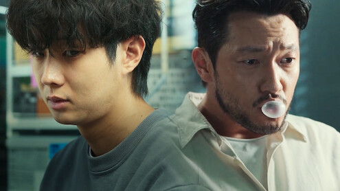 A split screen of Choi Woo-shik as Lee Tang and Son Suk-ku as Jang Nan-gam in season 1 of 'A Killer Paradox' 