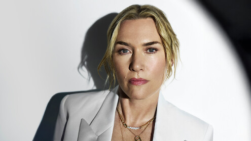 Kate Winslet with a spotlight on her face.
