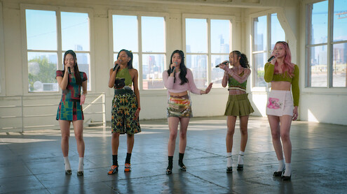 Members of KATSEYE singing.
