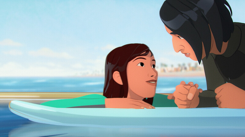 Two animated characters on surfboards are floating in the ocean, having an intimate conversation. In the background, there is a blurred shoreline with palm trees, under a bright blue sky.