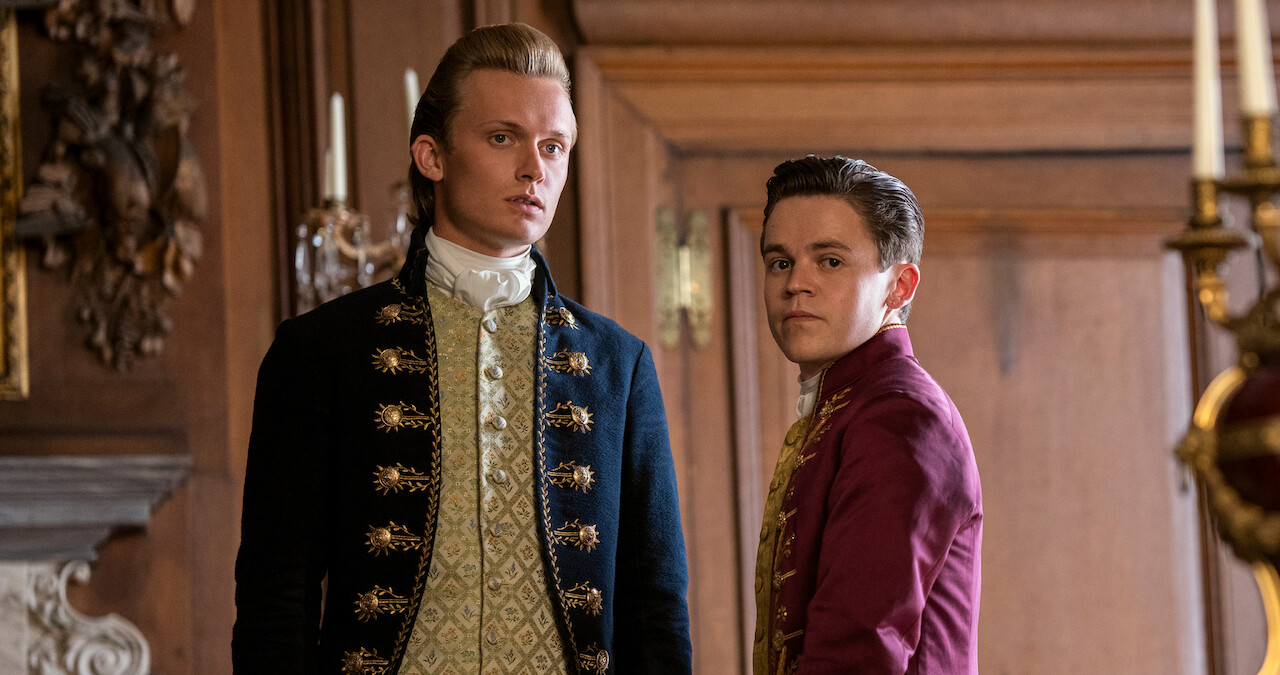 Reynolds and Brimsley stand next to each other in Queen Charlotte