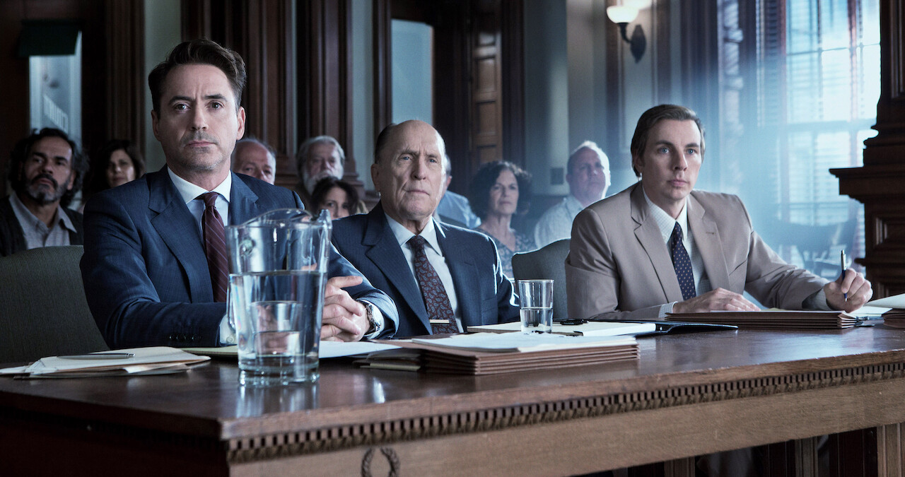 Robert Downey Jr., Robert Duvall, and Dax Shepherd sitting in a courtroom.