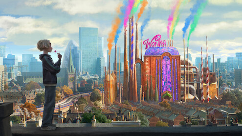 A child stands on a city rooftop overlooking a colorful, whimsical chocolate factory with rainbow smoke, surrounded by modern buildings and a bright sky.