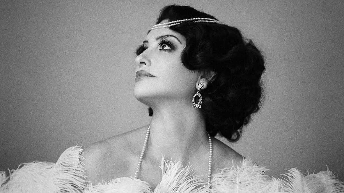 Black and white photo of Penélope Cruz in character as Néne Romero in La Bola Negra