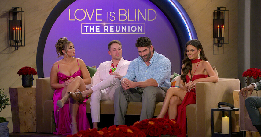 Cast members of season 6 of 'Love Is Blind' sit on a couch at the Reunion. 