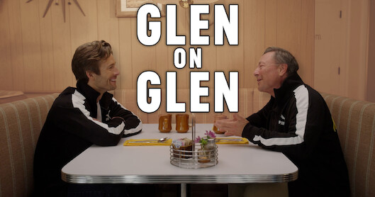 Glen Powell, left, sitting in a diner booth across from his father, Glen Powell Sr.
