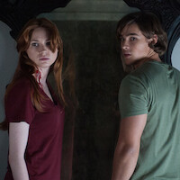 Karen Gillan wearing a red shirt and Brenton Thwaites in a green shirt in Mike Flanagan's Oculus