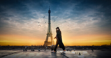 Omar Sy as Assane Diop walks though Paris in Season 3 of 'Lupin'