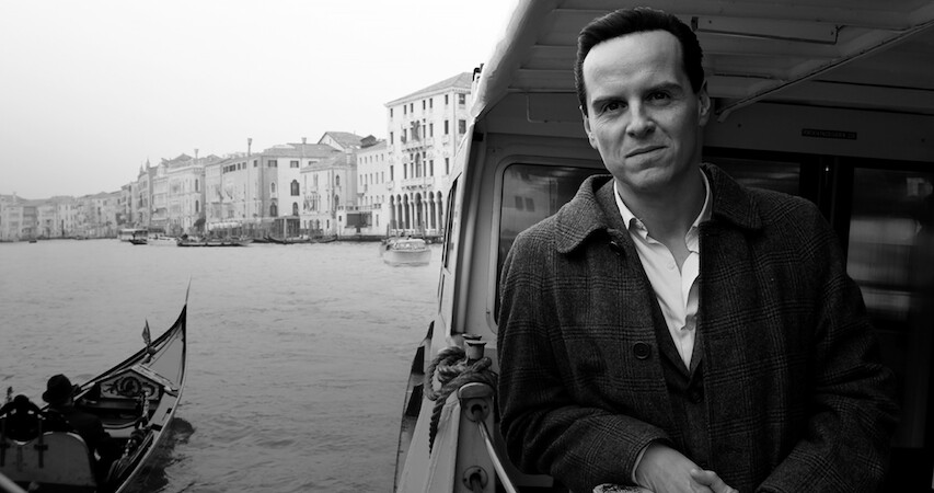 Andrew Scott as Tom Ripley rides on a boat in Venice in 'Ripley'