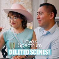 Two people sit together on a patio, one wearing a pink hat and holding a drink, both smiling. Text reads "Love on the Spectrum Deleted Scenes!" The environment looks relaxed and friendly.
