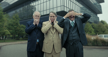Sam Anderson as Raymond Sackler, Matthew Broderick as Richard Sackler, and John Rothman as Mortimer Sackler pose covering their mouth, ears, and eyes respectively in Season 1 of 'Painkiller.'  