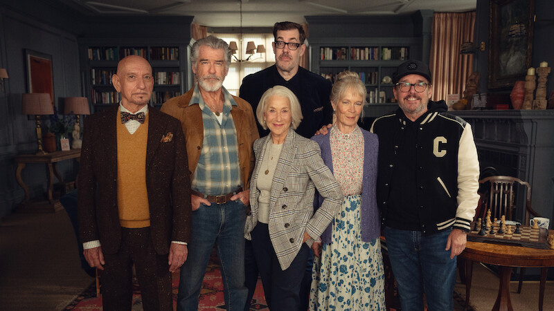 Sir Ben Kingsley as Ibrahim Arif, Pierce Brosnan as Ron Ritchie, Author Richard Osman, Helen Mirren as Elizabeth Best, Celia Imrie as Joyce Meadowcroft & Director Chris Columbus behind the scenes of 'The Thursday Murder Club'